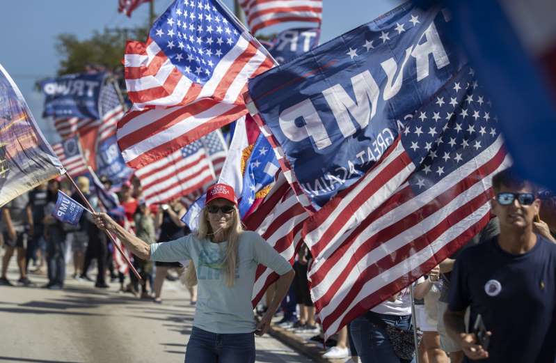 © Joe Raedle/Getty Supporters of former President Donald Trump gather near Trump's Mar-a-Lago home on February 15, 2021 in West Palm Beach, Florida.