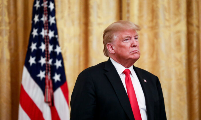 Then-President Donald Trump participates in the Salute to the Heroes of the Immigration and Customs Enforcement and Customs and Border Protection in the East Room at the White House in Washington on Aug. 20, 2018. (Samira Bouaou/The Epoch Times)